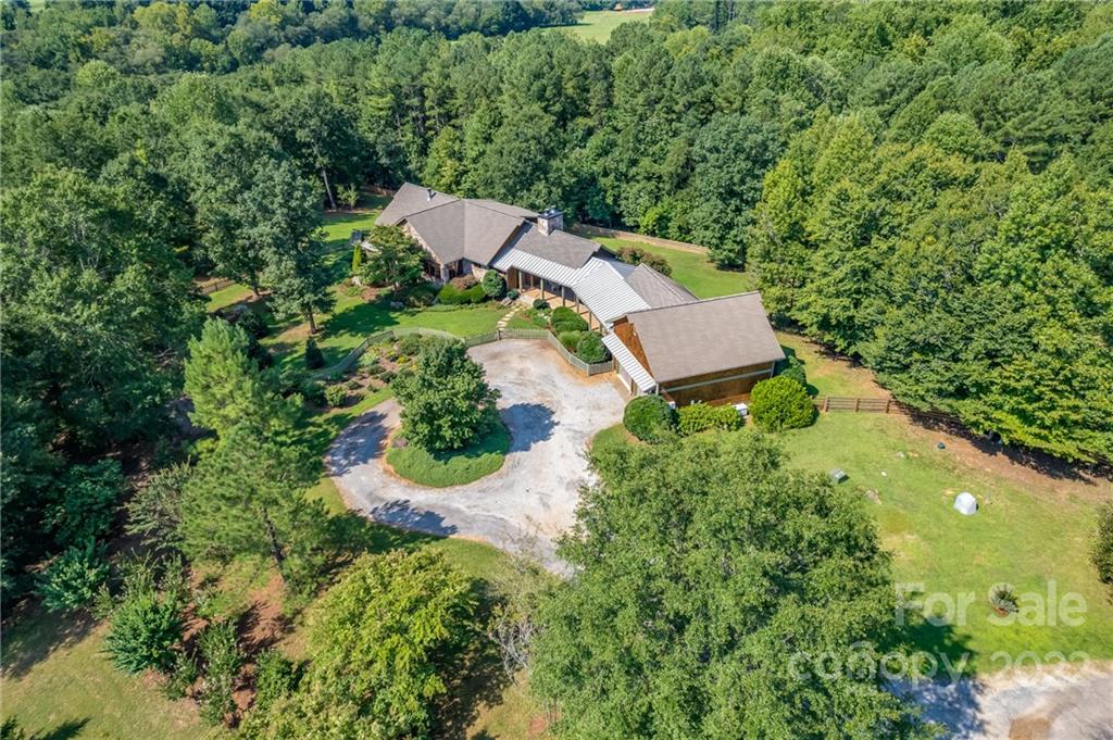 1360 South Phillips Road Columbus, NC 28722 - Photo 8 of 41 an aerial view of a house with yard swimming pool and outdoor seating
