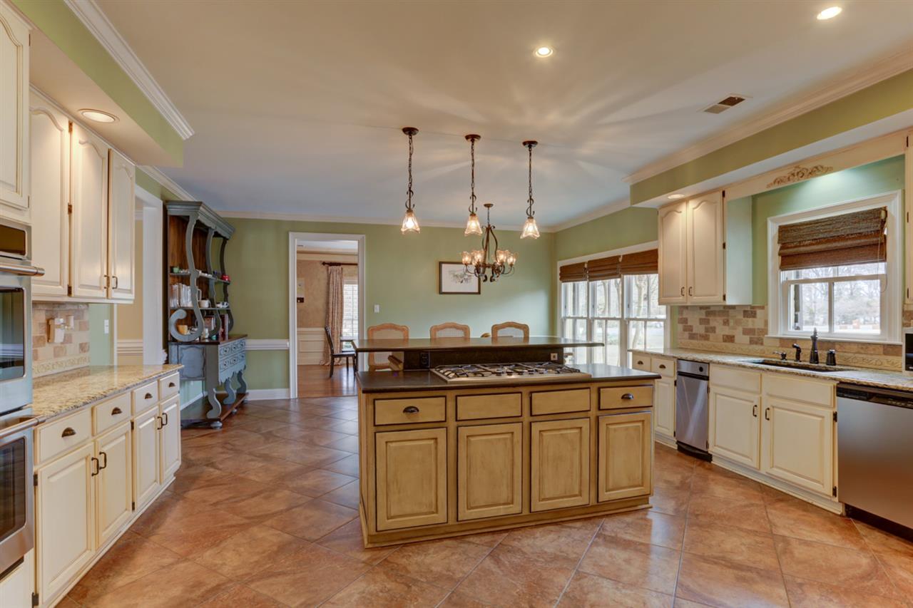2420 Johnson Road Germantown, TN 38139 - Photo 12 of 25 Another picture of the kitchen. Gas cooktop sits in the island. Kitchen also features double ovens, built-in refrigerator and nice size pantry.
