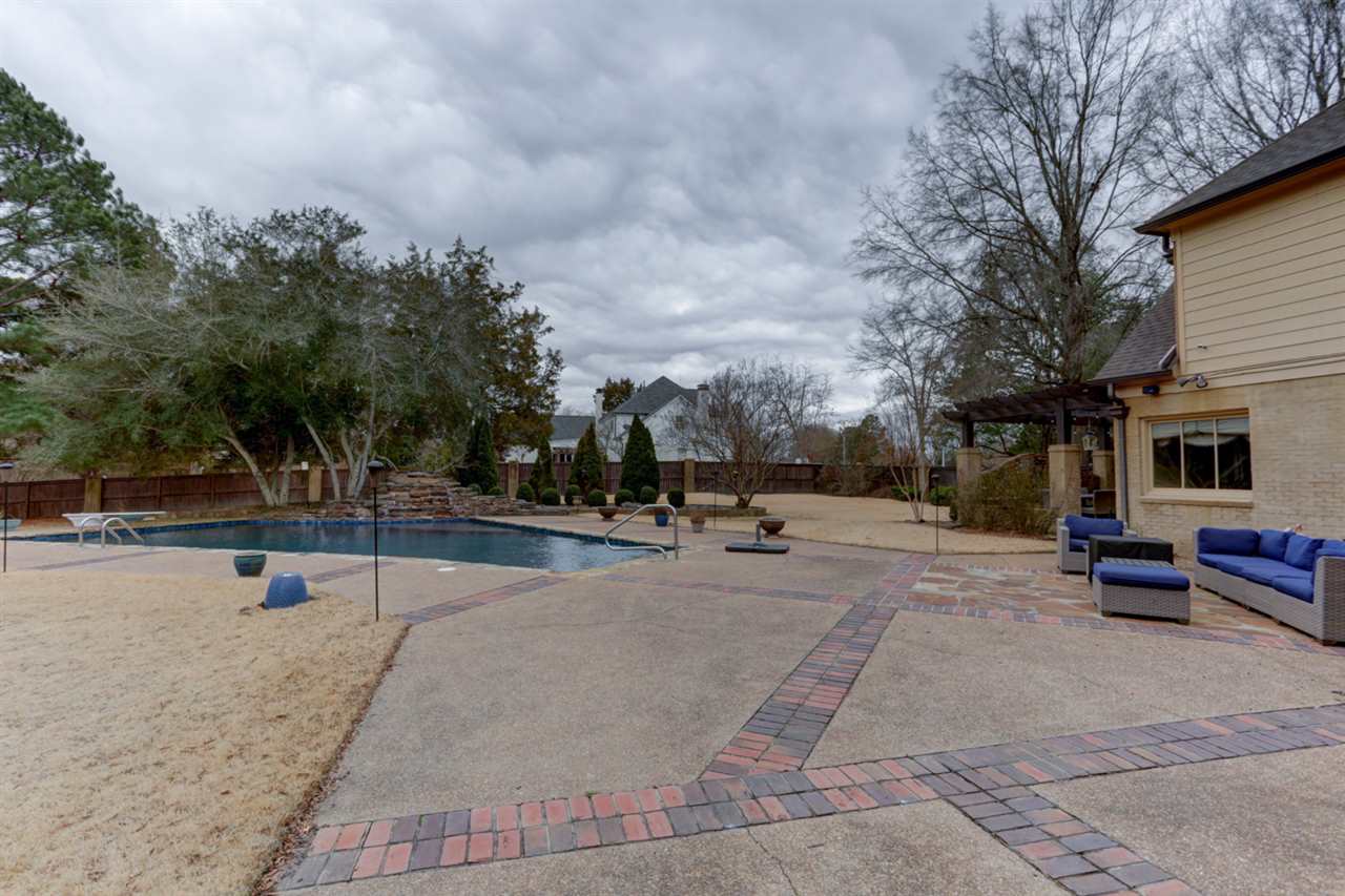 2420 Johnson Road Germantown, TN 38139 - Photo 5 of 25 Enjoy your spring, summer and fall on this beautiful patio listening to the pool's waterfall.