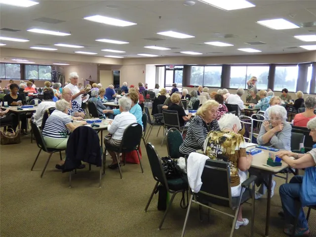 a room with furniture pool table and windows