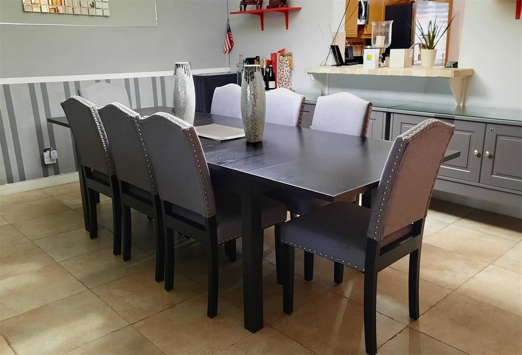 291 South Hollybrook Drive, Unit 305 Pembroke Pines, FL 33025 - Photo 2 of 16 a view of a dining room with furniture