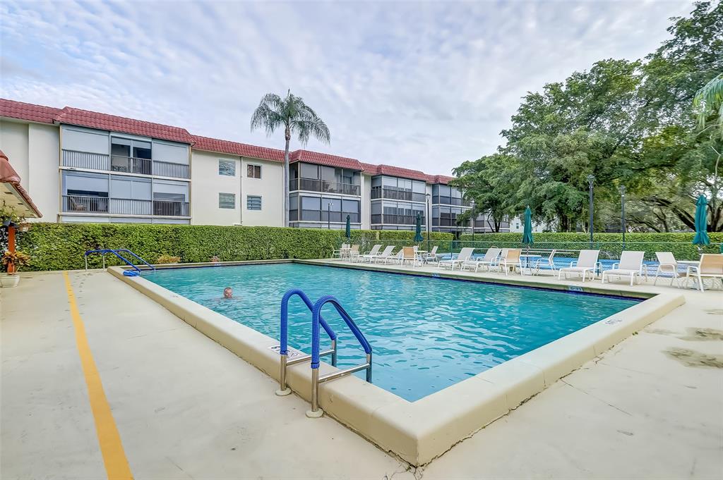 291 South Hollybrook Drive, Unit 305 Pembroke Pines, FL 33025 - Photo 9 of 16 a view of swimming pool with a patio