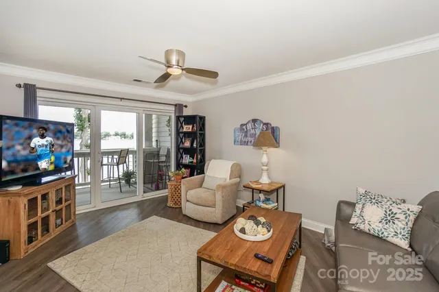 a kitchen with refrigerator and chairs