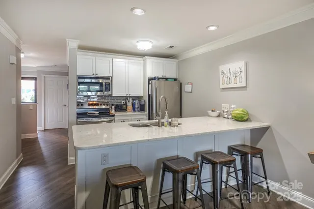 a bedroom with a large bed and a tv