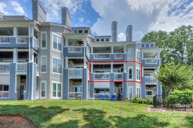 an aerial view of a house with a lake view