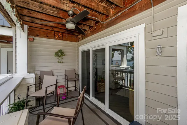 a kitchen with stainless steel appliances a table chairs refrigerator and sink