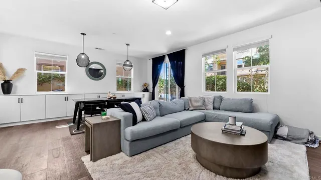 a living room with furniture and a large window