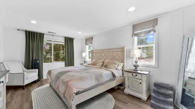 a bedroom with a bed and a couch