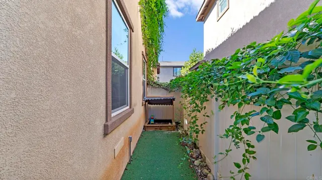 a backyard of a house with a garden