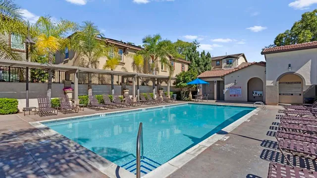 a view of swimming pool with outdoor seating