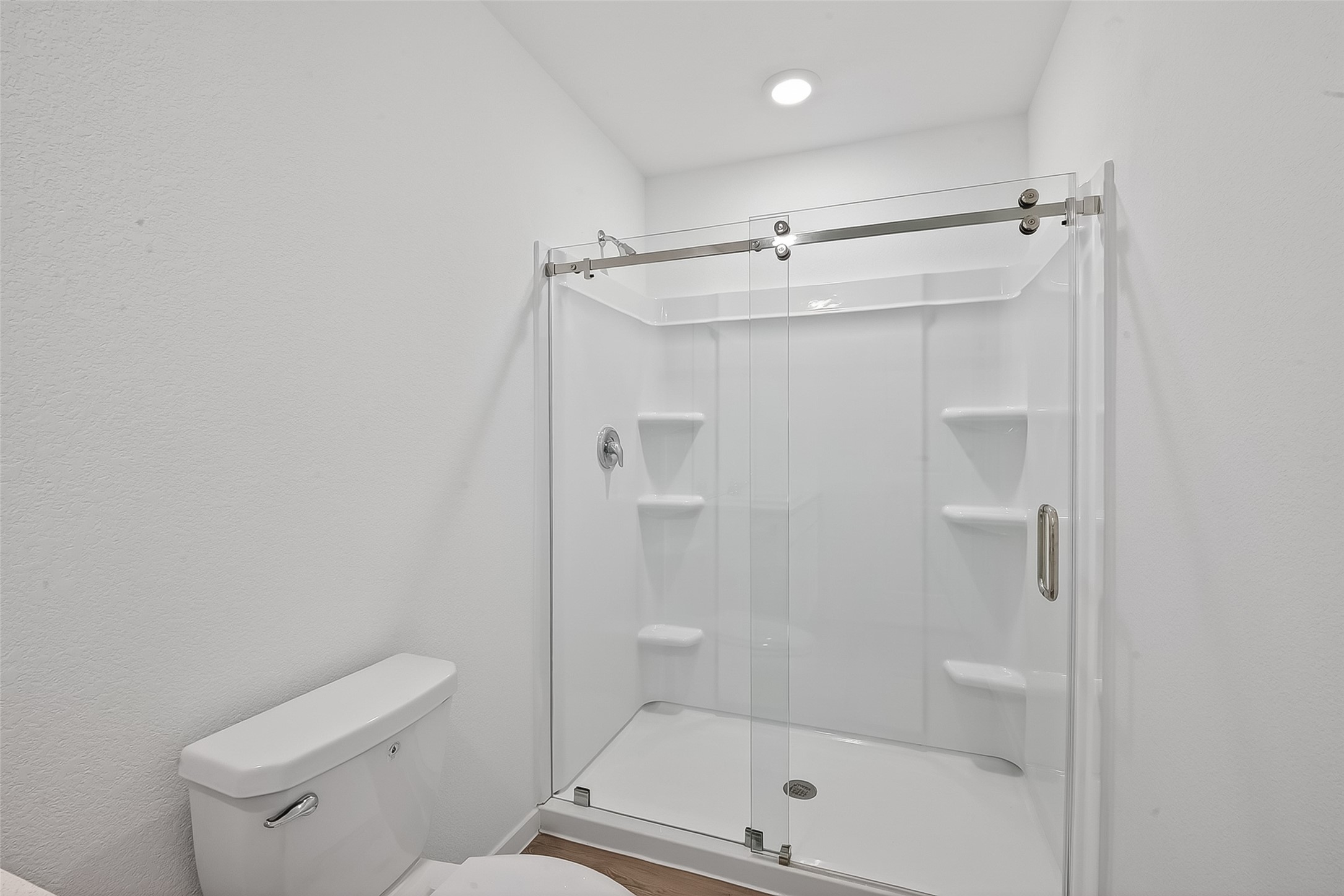 2623 American Ruby Drive Rosharon, TX 77583 - Photo 8 of 14 The ensuite bath in the primary features a large walk-in shower.