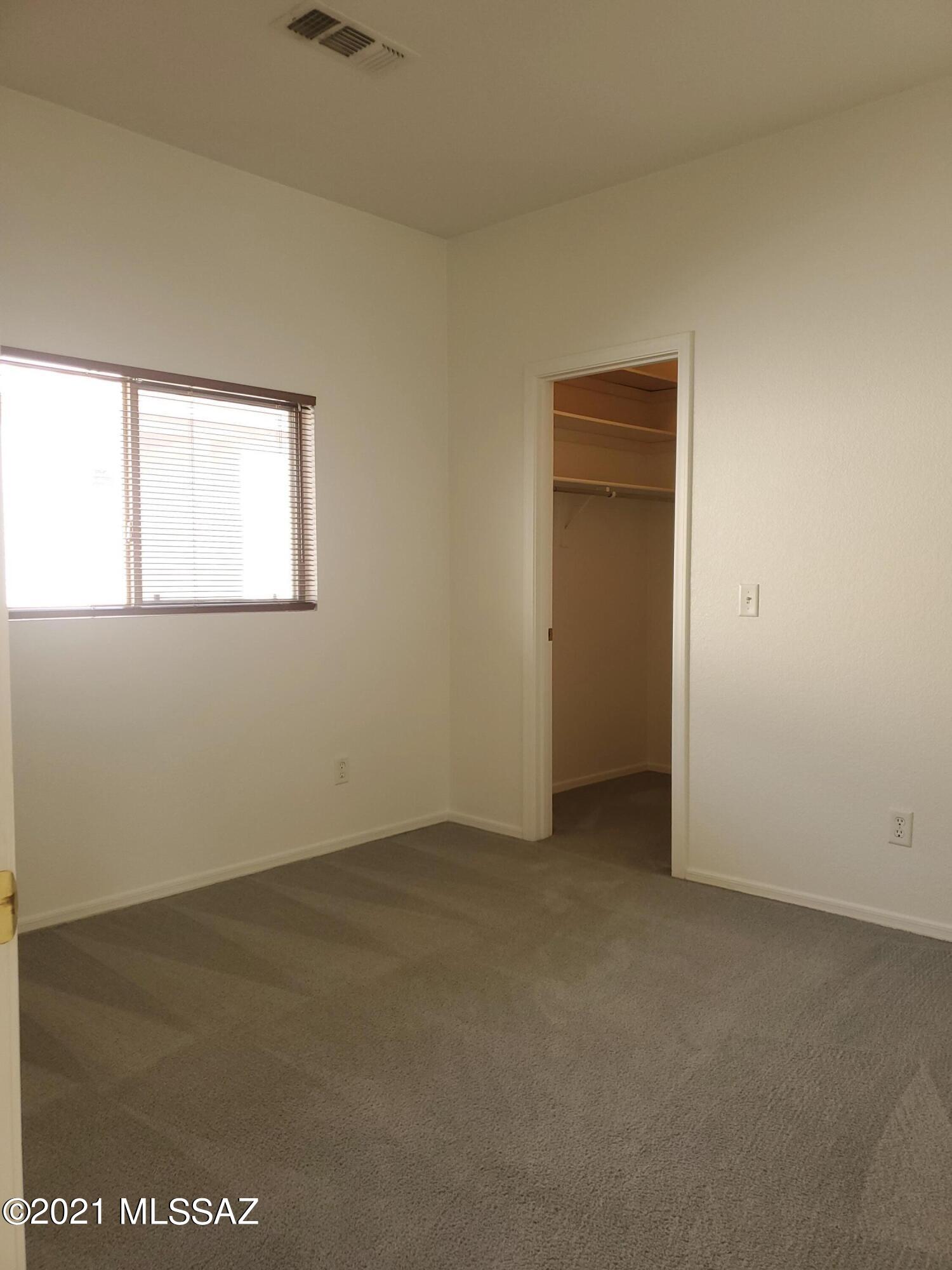 3455 North Boyce Spring Lane Tucson, AZ 85745 - Photo 6 of 21 an empty room with a window
