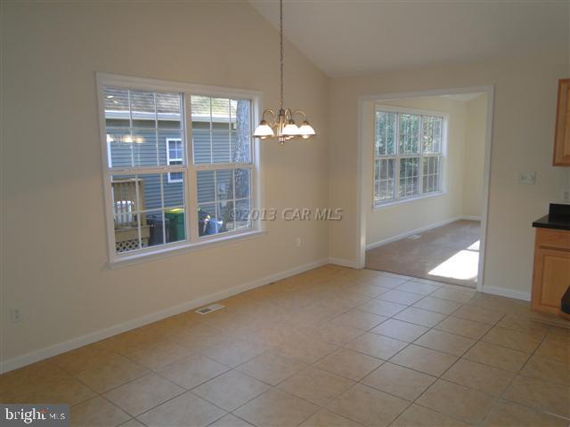 240 Windjammer Road Berlin, MD 21811 - Photo 3 of 22 a view of an empty room with a window