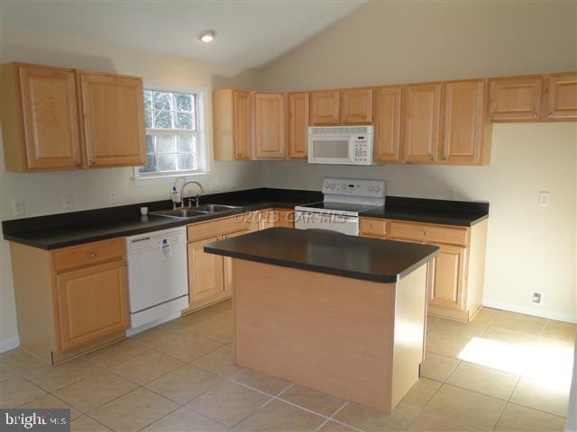 240 Windjammer Road Berlin, MD 21811 - Photo 4 of 22 a kitchen with granite countertop a sink a stove and cabinets