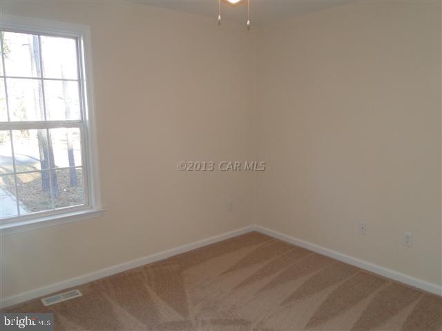 240 Windjammer Road Berlin, MD 21811 - Photo 5 of 22 an empty room with a window
