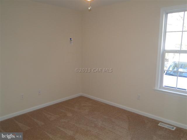 240 Windjammer Road Berlin, MD 21811 - Photo 6 of 22 an empty room with a window