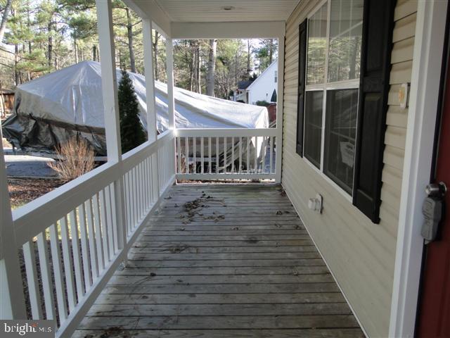 240 Windjammer Road Berlin, MD 21811 - Photo 10 of 22 a view of a balcony with wooden floor