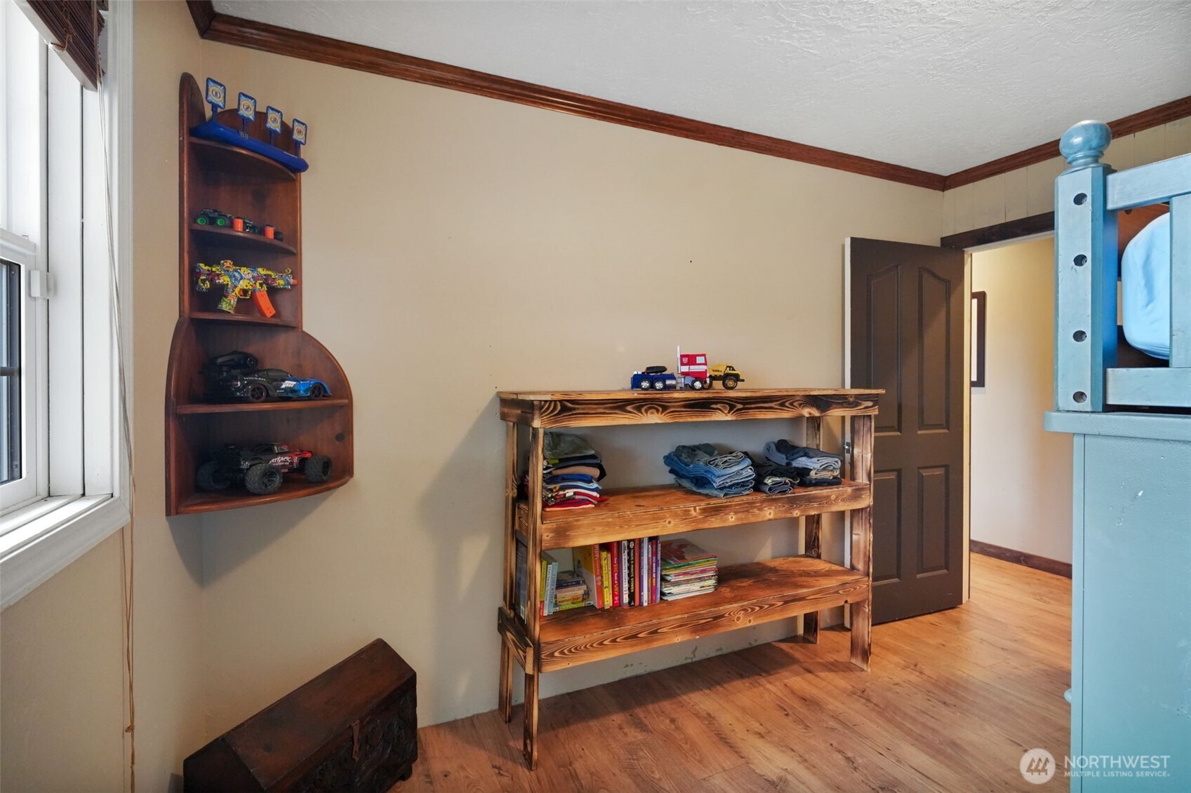 142 Drews Prairie Road Toledo, WA 98591 - Photo 12 of 33 a bedroom with furniture and wooden floor