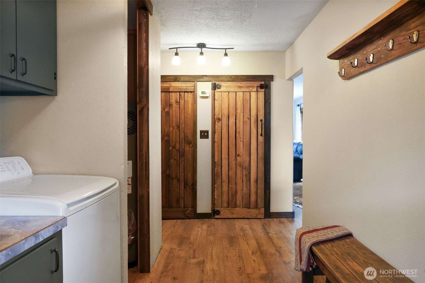 142 Drews Prairie Road Toledo, WA 98591 - Photo 18 of 33 a view of a hallway with washer and dryer