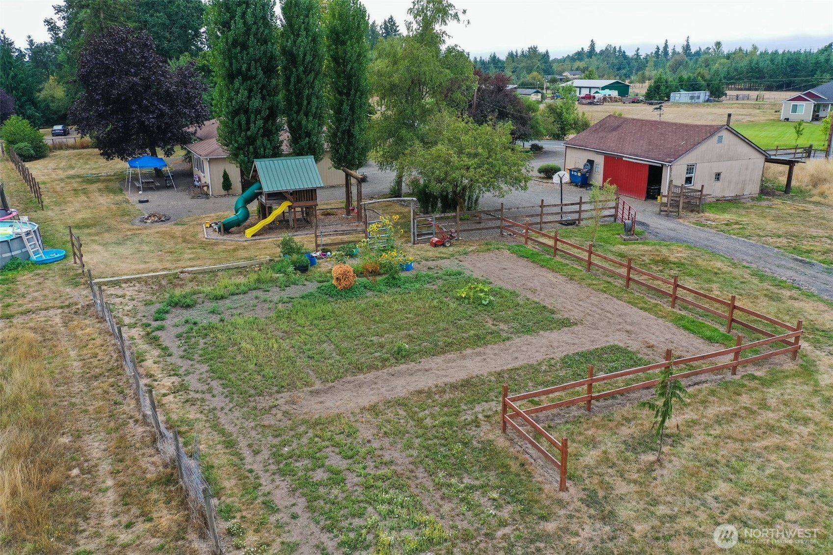 142 Drews Prairie Road Toledo, WA 98591 - Photo 30 of 33 a view of backyard with swimming pool and seating space