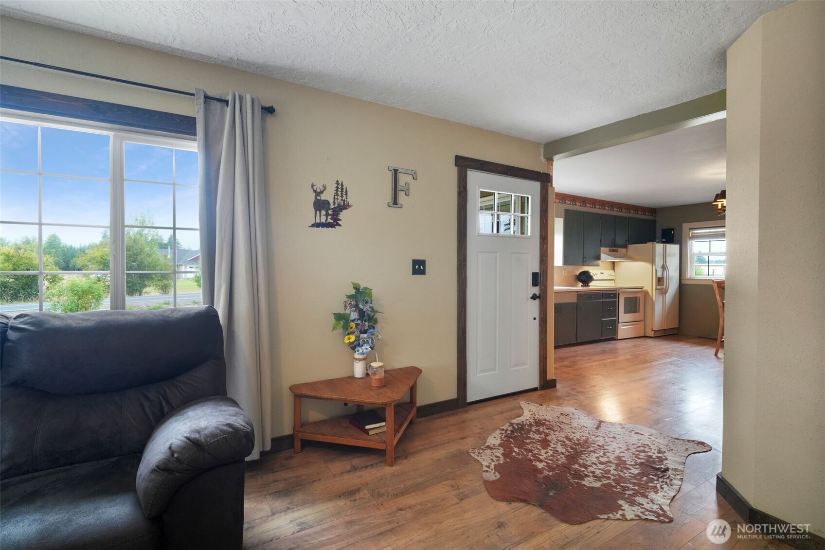 142 Drews Prairie Road Toledo, WA 98591 - Photo 5 of 33 a living room with furniture and a large window