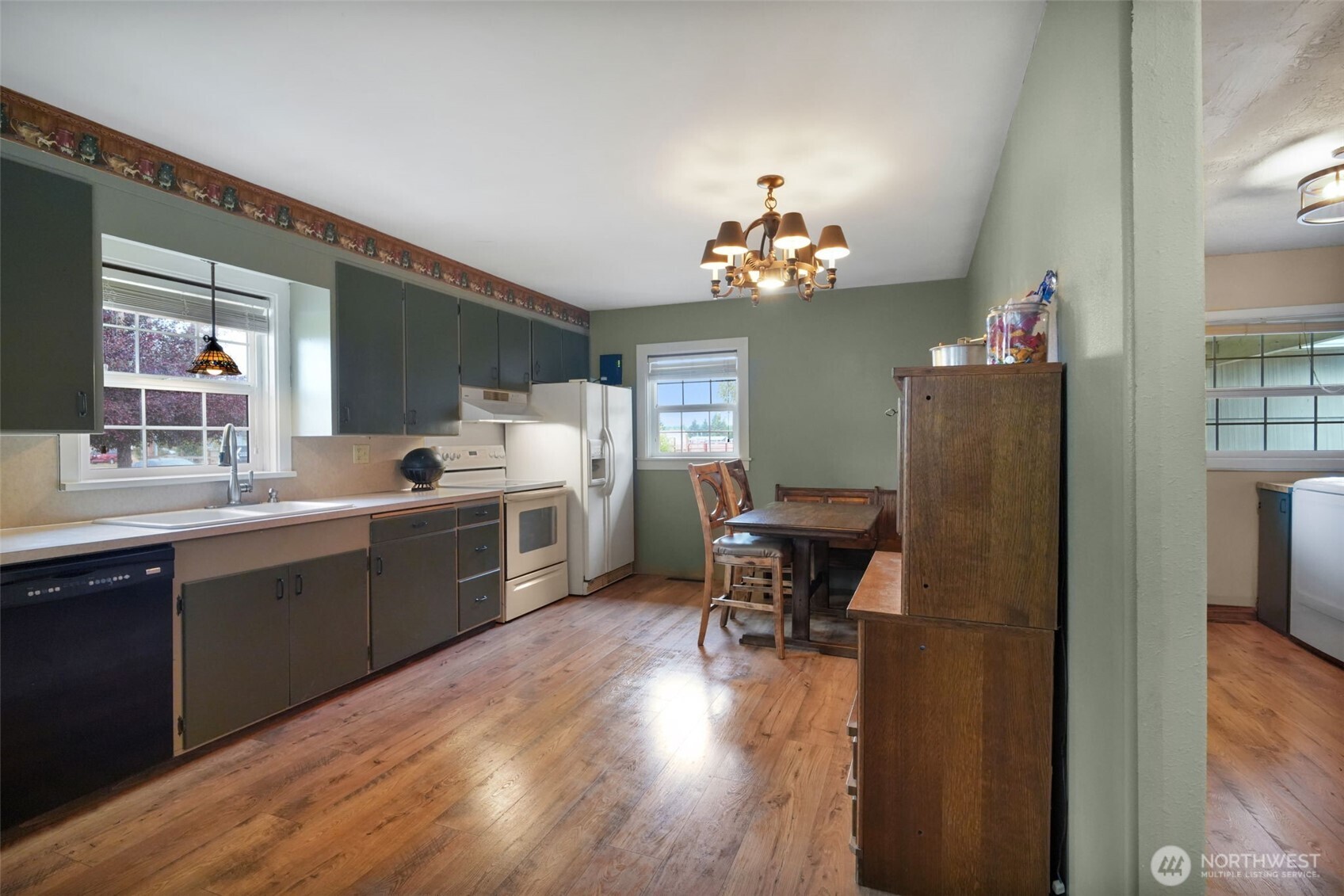 142 Drews Prairie Road Toledo, WA 98591 - Photo 7 of 33 a kitchen with sink cabinets and wooden floor