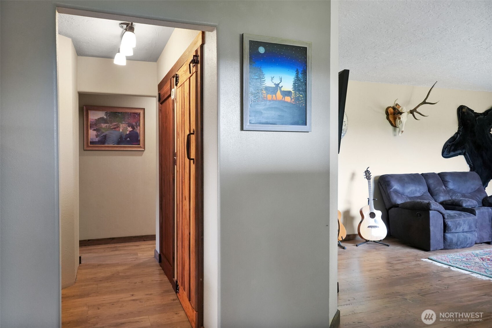 142 Drews Prairie Road Toledo, WA 98591 - Photo 9 of 33 a view of a hallway with furniture and wooden floor