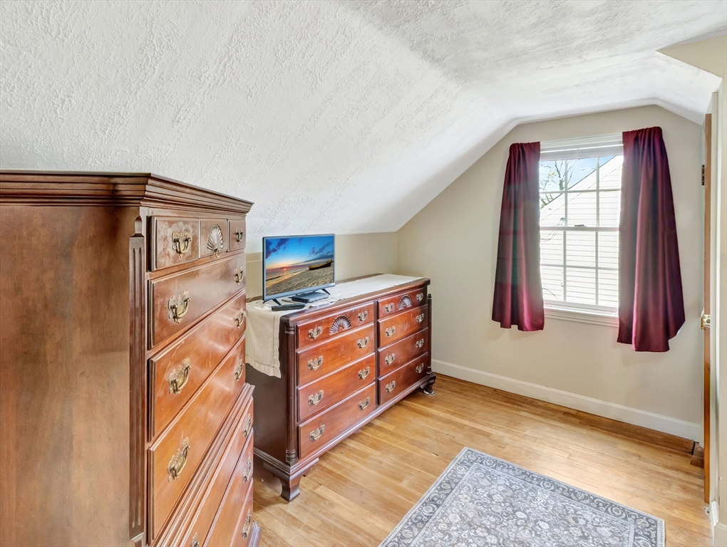5 G Street Hull, MA 02045 - Photo 33 of 41 a bed room with a bed and a window