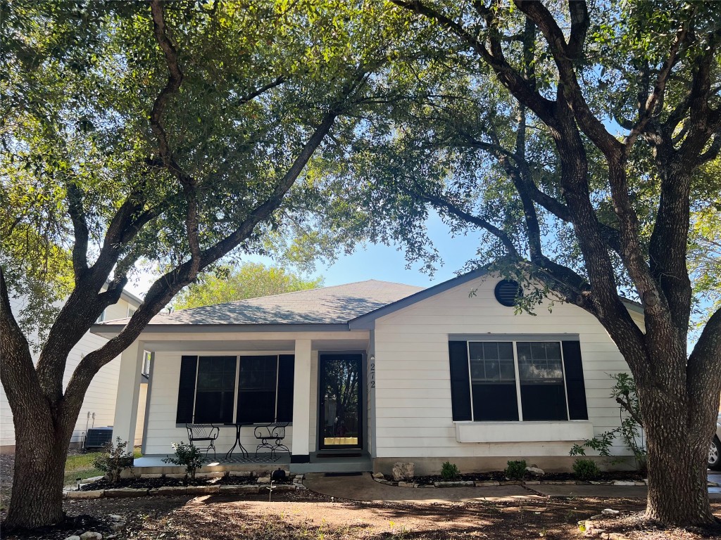 272 Tobin Drive Buda, TX 78610 - Photo 1 of 20 a front view of a house with a tree