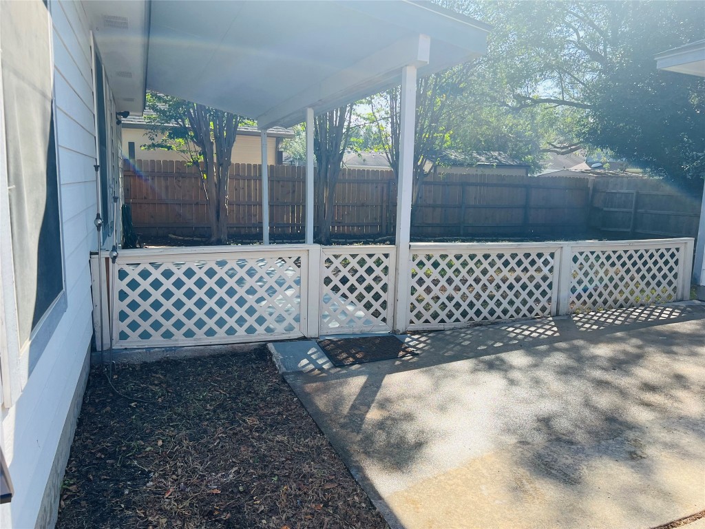 272 Tobin Drive Buda, TX 78610 - Photo 5 of 20 a view of a wooden fence