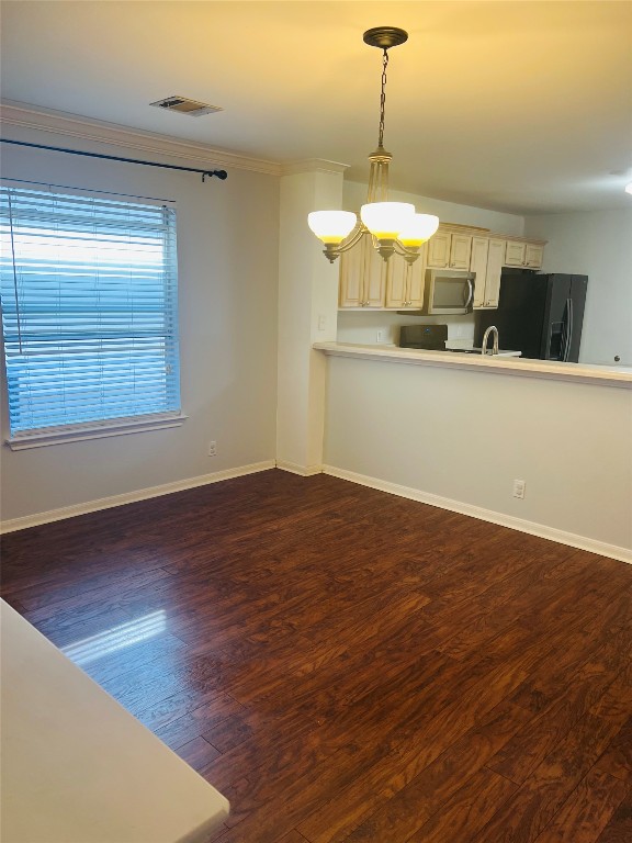 272 Tobin Drive Buda, TX 78610 - Photo 10 of 20 a view of a room with wooden floor and chandelier
