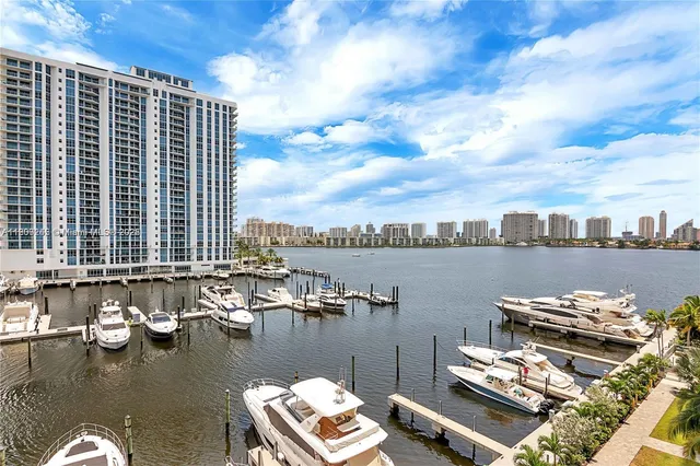 a view of a lake with chairs on roof deck