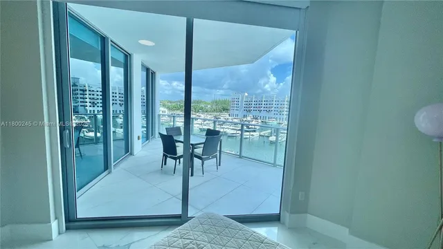 a view of a room with a table and chairs