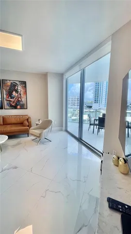 a view of a livingroom with furniture and windows