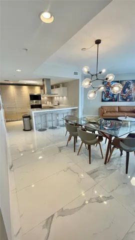 a kitchen with a table and chairs in it