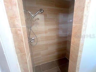 479 Water Road Ocala, FL 34472 - Photo 14 of 31 a bathroom with a glass door shower