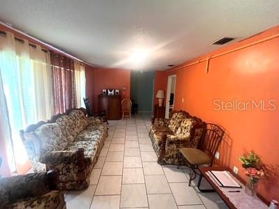479 Water Road Ocala, FL 34472 - Photo 16 of 31 a living room with furniture and a large window