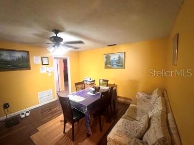 479 Water Road Ocala, FL 34472 - Photo 7 of 31 a view of a dining room with furniture and a chandelier