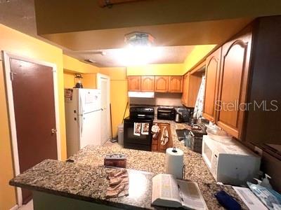 479 Water Road Ocala, FL 34472 - Photo 9 of 31 a living room with stainless steel appliances granite countertop furniture and a refrigerator