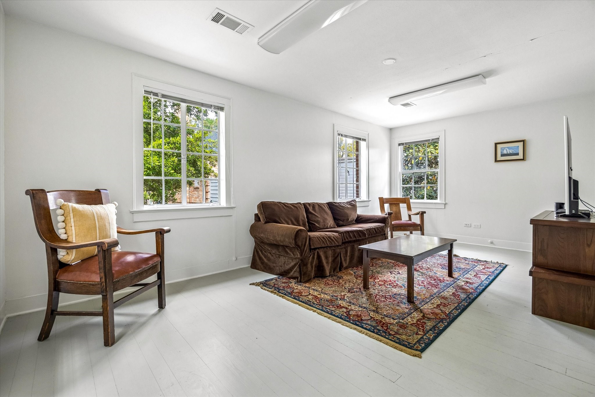 2133 Inwood Drive Houston, TX 77019 - Photo 15 of 22 Private quarters above the garage include a cheerful living area framed by generous windows.