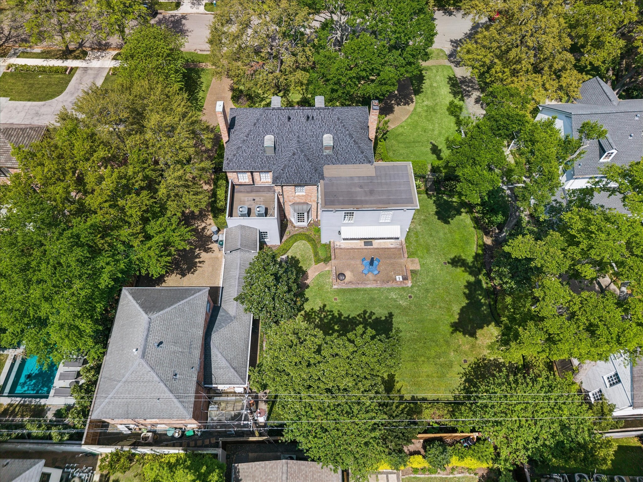 2133 Inwood Drive Houston, TX 77019 - Photo 20 of 22 Aerial view highlights the home’s generous backyard and tree-lined setting.