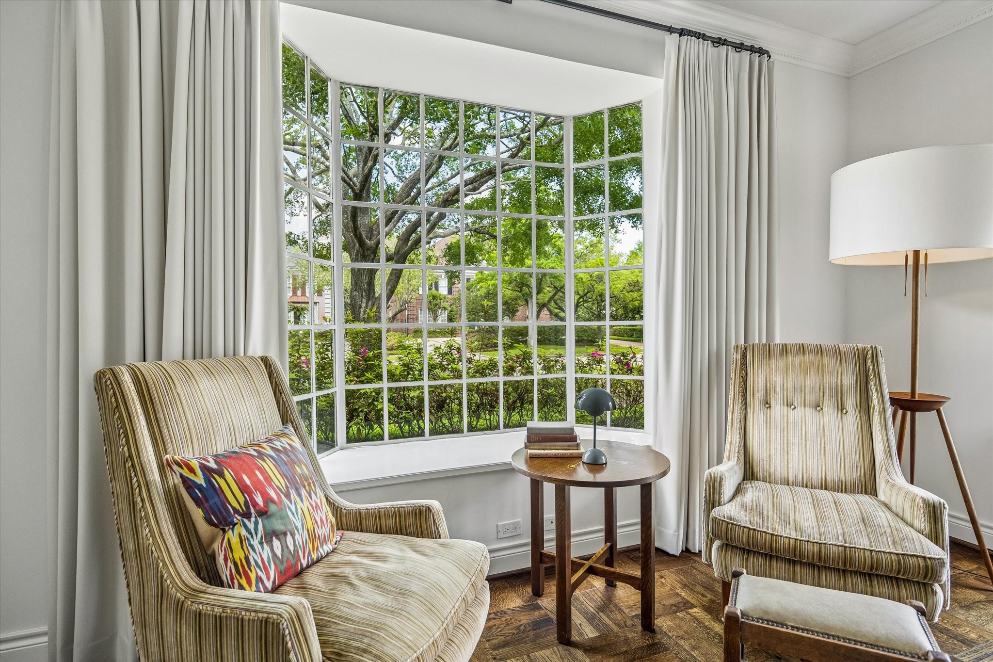 2133 Inwood Drive Houston, TX 77019 - Photo 8 of 22 This cozy nook set in front of a large bay window with lush garden views, is bright and inviting, perfect for relaxing or reading.