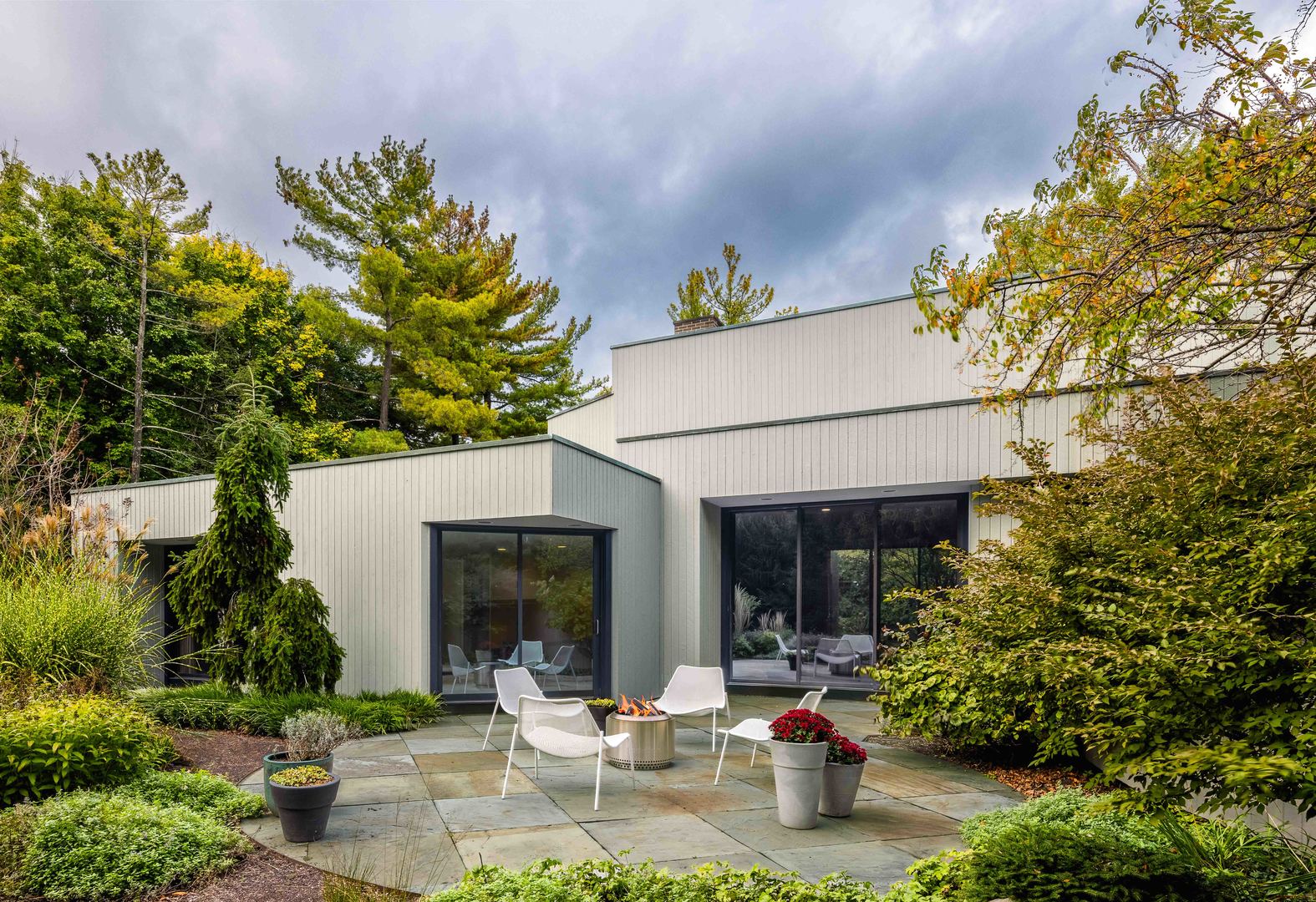 296 White Oak Lane Winnetka, IL 60093 - Photo 1 of 42 a view of a patio with table and chairs and potted plants