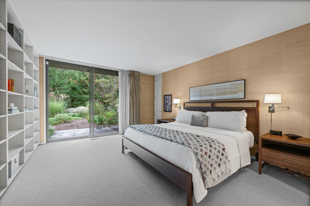 296 White Oak Lane Winnetka, IL 60093 - Photo 23 of 42 a bedroom with a balcony a bed and a large window