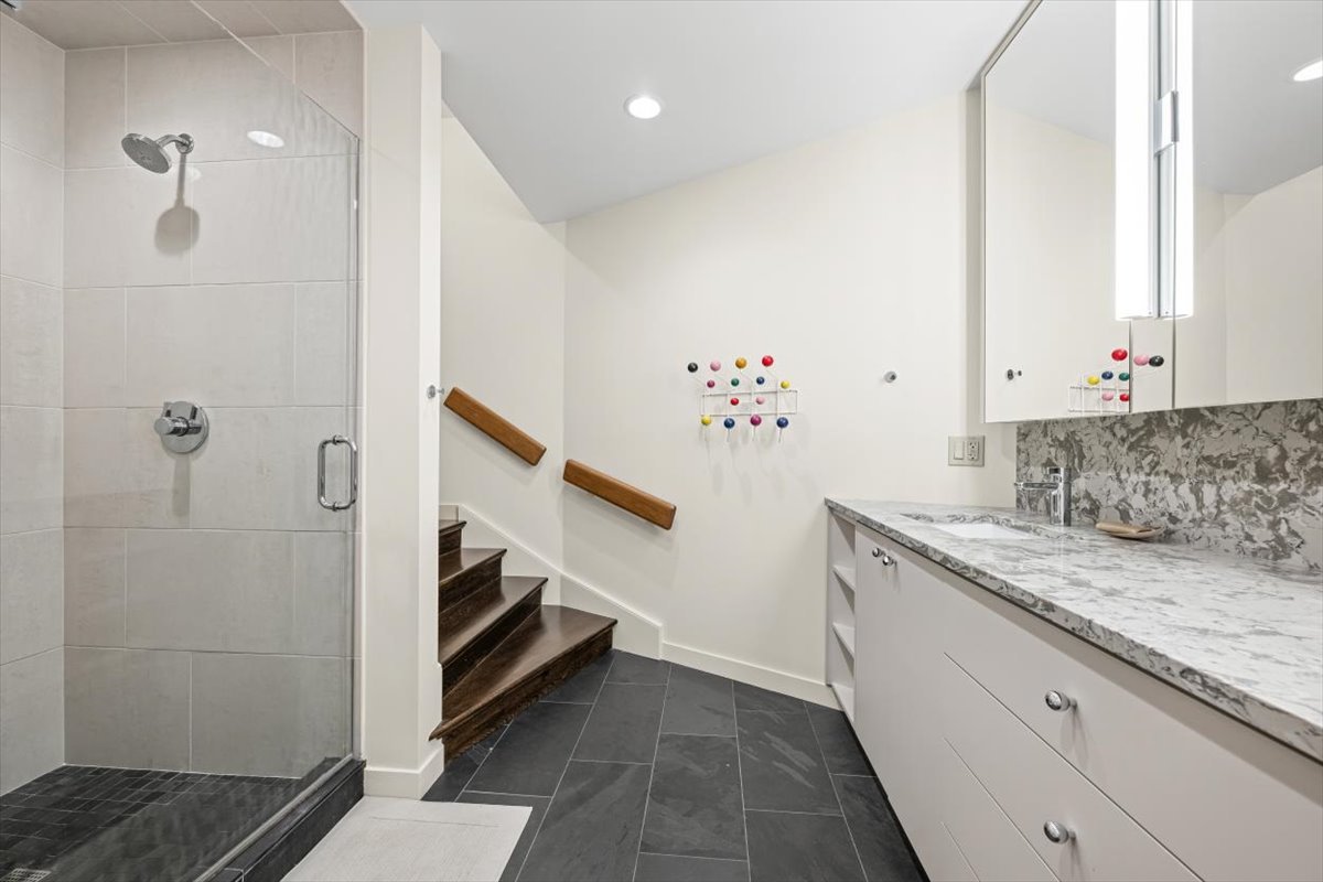 296 White Oak Lane Winnetka, IL 60093 - Photo 34 of 42 a bathroom with a granite countertop sink and a mirror