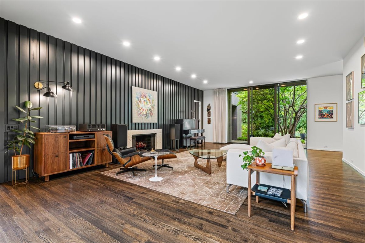 296 White Oak Lane Winnetka, IL 60093 - Photo 7 of 42 a living room with furniture a large window and wooden floor