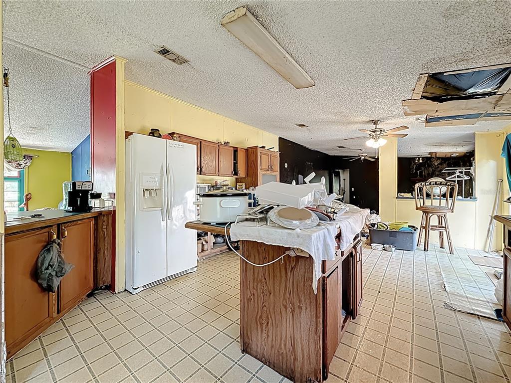 2414 Brock Road Plant City, FL 33565 - Photo 11 of 63 a view of a kitchen and dining room