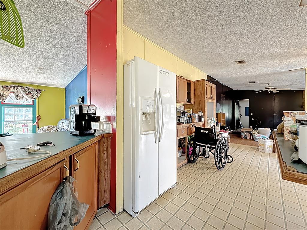 2414 Brock Road Plant City, FL 33565 - Photo 12 of 63 a kitchen with stainless steel appliances lots of counter top space and furniture