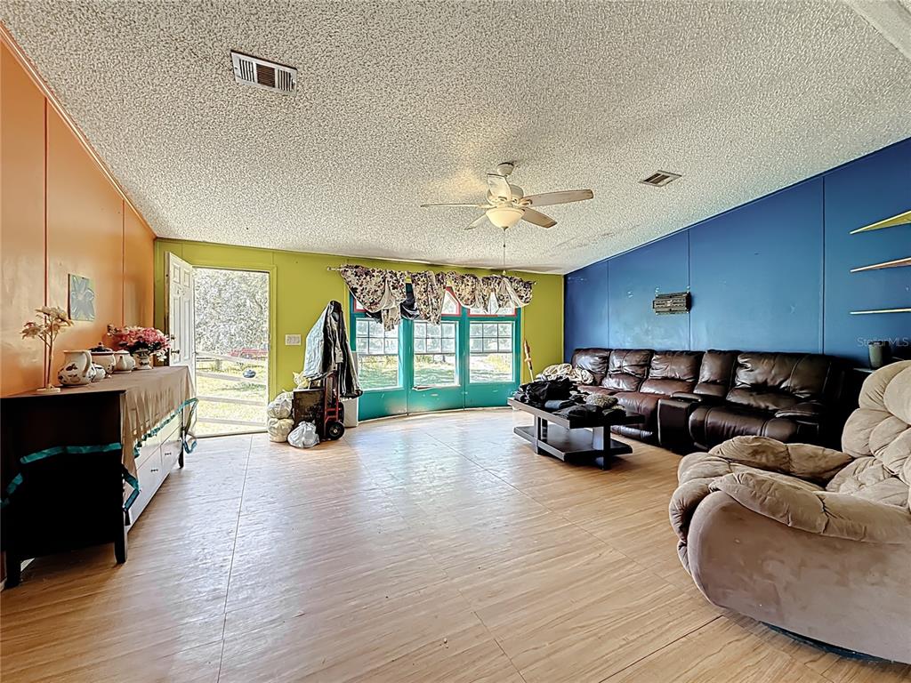 2414 Brock Road Plant City, FL 33565 - Photo 17 of 63 a living room with furniture and a large window