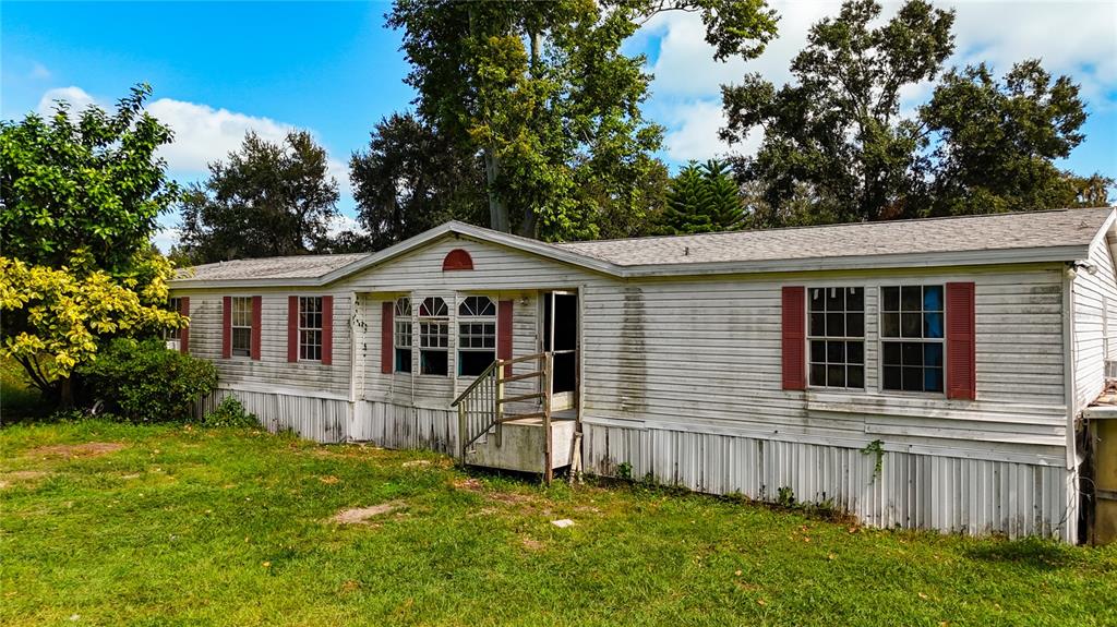 2414 Brock Road Plant City, FL 33565 - Photo 2 of 63 a front view of a house with a yard